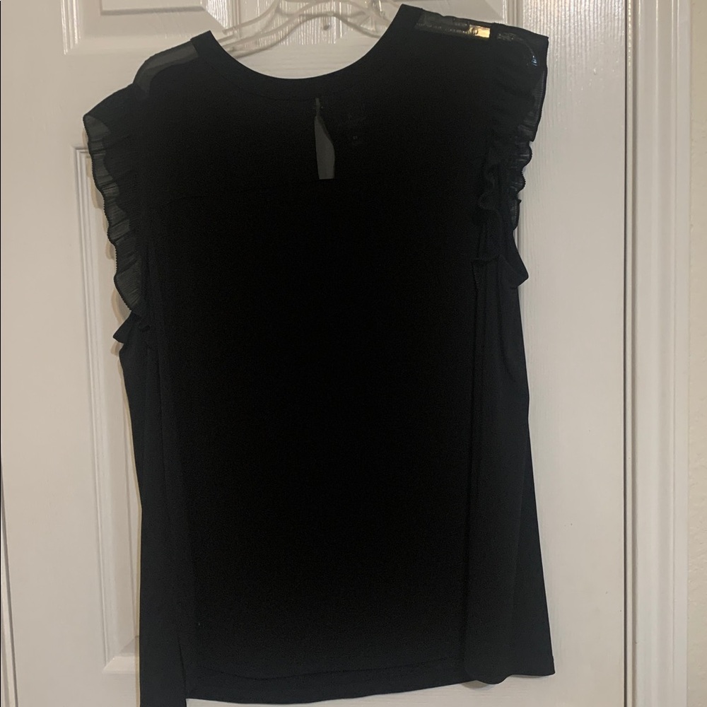 Plus size Black SleevelessTop with sheer ruffles at arm holes.